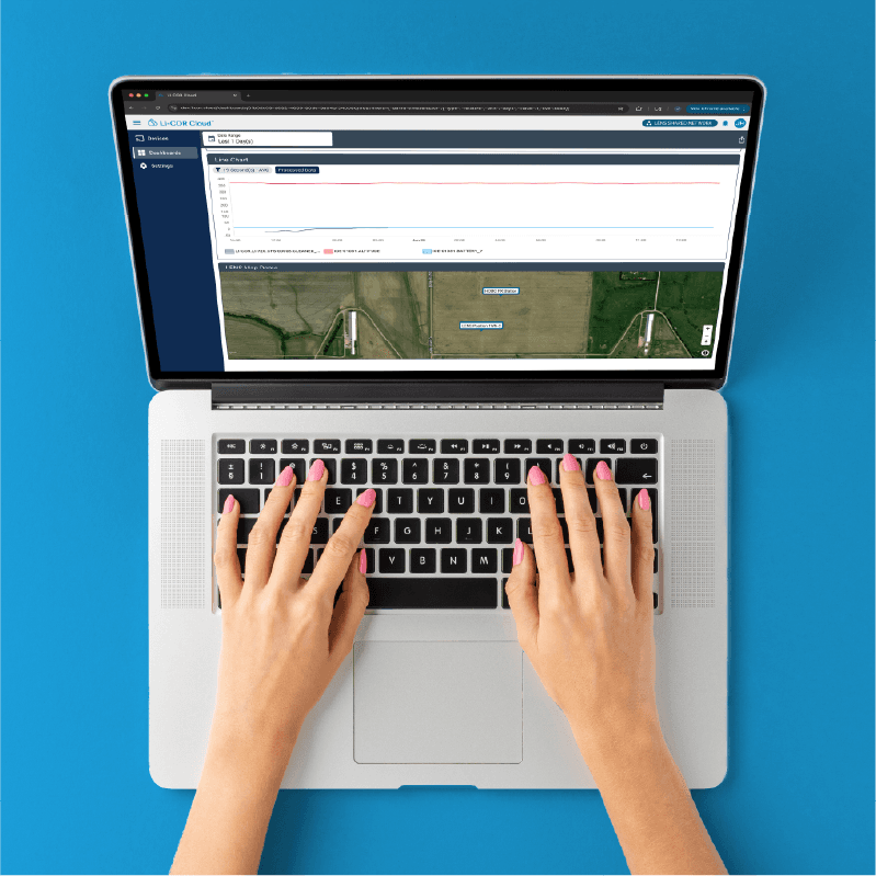 Graphic illustration of a laptop sharing data to and from a cloud